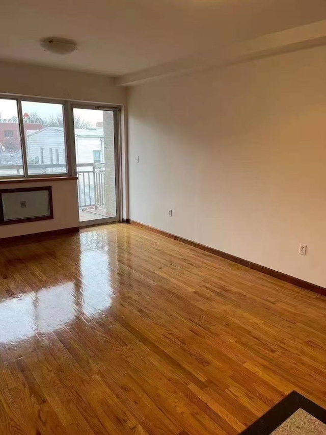 8827 53 Rd Ave Unit 2R, Elmhurst, NY 11373 - empty room featuring wood finished floors and baseboards