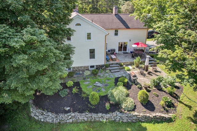 35 Everett Rd, Goshen, NY 10916 - back of house featuring a patio area, a chimney, and a fire pit