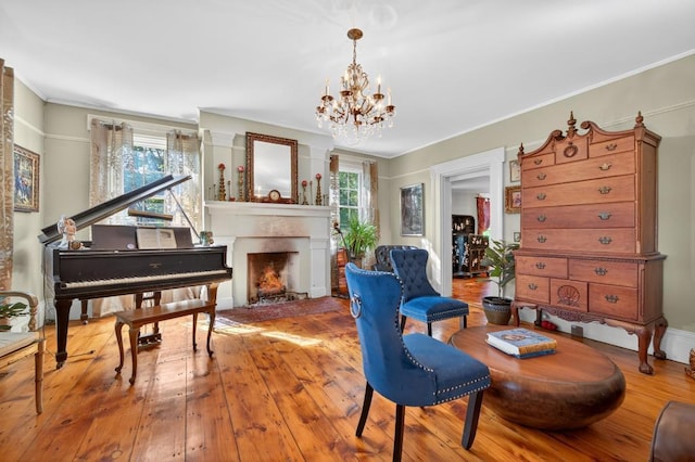 35 Everett Rd, Goshen, NY 10916 - living area with a lit fireplace, a chandelier, hardwood / wood-style floors, and crown molding