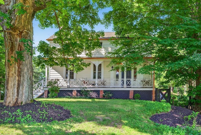 35 Everett Rd, Goshen, NY 10916 - rear view of house with covered porch and a lawn