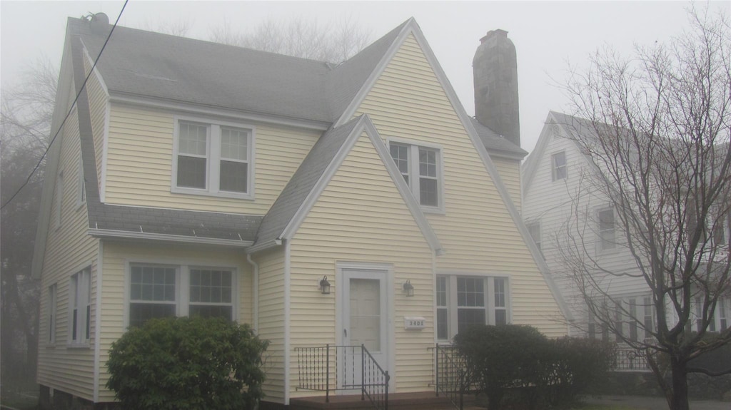 3401 Main St, Call Listing Agent, CT 06606 - view of front of home featuring a shingled roof and a chimney