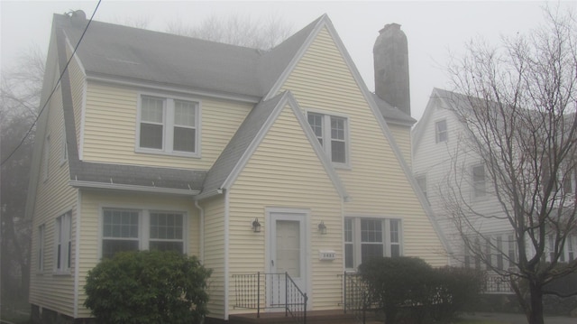 3401 Main St, Call Listing Agent, CT 06606 - view of front of home featuring a shingled roof and a chimney