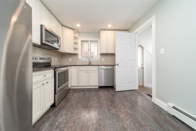 7 Miller Dr, Lake Grove, NY 11755 - kitchen with stainless steel appliances, baseboard heating, open shelves, dark countertops, and backsplash