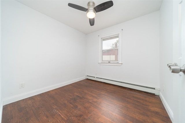 7 Miller Dr, Lake Grove, NY 11755 - empty room with a baseboard heating unit, dark wood finished floors, and a ceiling fan