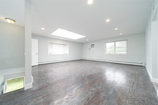 7 Miller Dr, Lake Grove, NY 11755 - empty room featuring a skylight, wood finished floors, an AC wall unit, baseboard heating, and recessed lighting
