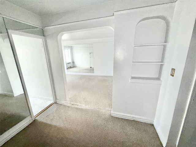 61-41 Saunders St Unit B44, Rego Park, NY 11374 - hallway featuring carpet flooring and baseboards