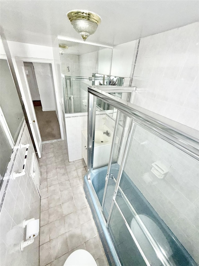 61-41 Saunders St Unit B44, Rego Park, NY 11374 - full bathroom with a shower stall and tile patterned flooring