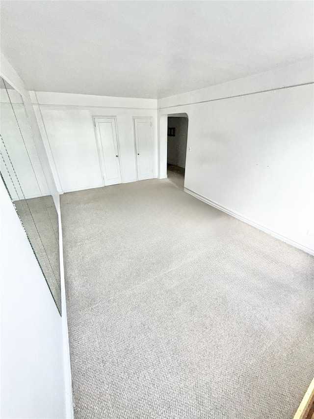 61-41 Saunders St Unit B44, Rego Park, NY 11374 - carpeted empty room featuring arched walkways