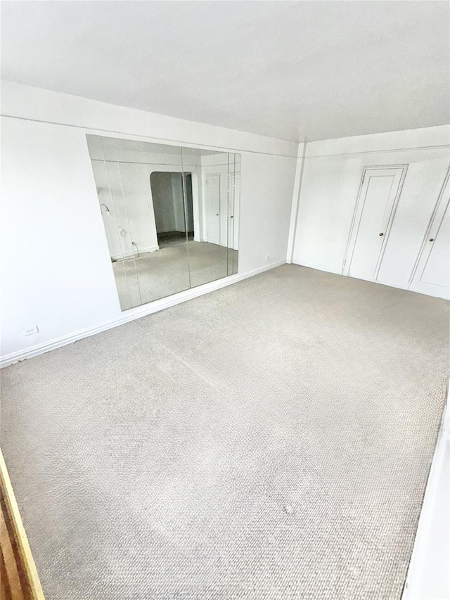 61-41 Saunders St Unit B44, Rego Park, NY 11374 - unfurnished bedroom featuring carpet and a closet