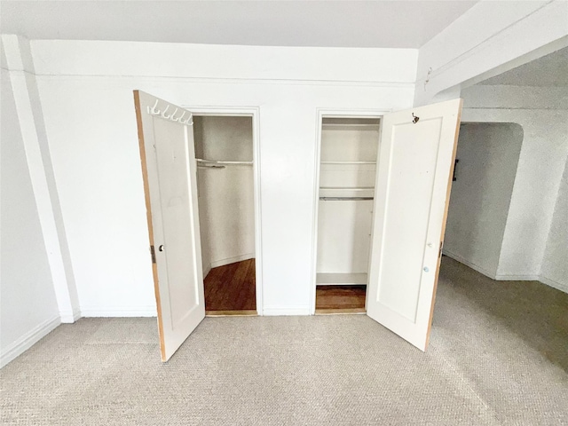 61-41 Saunders St Unit B44, Rego Park, NY 11374 - unfurnished bedroom featuring carpet flooring and two closets