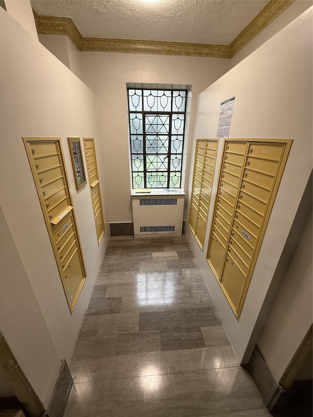 61-41 Saunders St Unit B44, Rego Park, NY 11374 - view of home's community with crown molding, mail area, and a textured ceiling