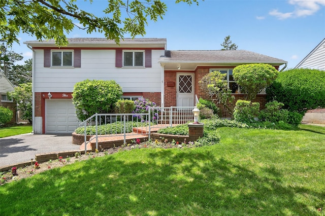 5 Clark St, Plainview, NY 11803 - split level home featuring brick siding, an attached garage, driveway, and a front lawn