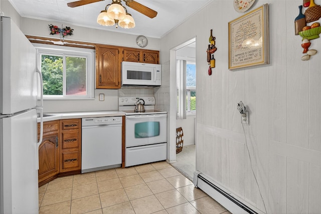 5 Clark St, Plainview, NY 11803 - kitchen featuring white appliances, brown cabinets, light countertops, ceiling fan, and light tile patterned floors