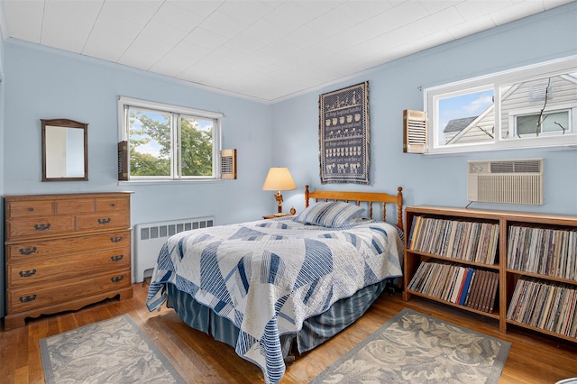 5 Clark St, Plainview, NY 11803 - bedroom featuring radiator, hardwood / wood-style flooring, ornamental molding, and an AC wall unit