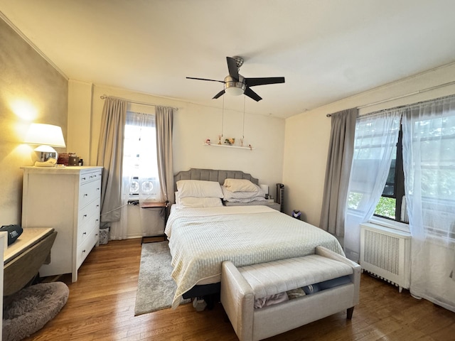 2208 76th St Unit A3, East Elmhurst, NY 11370 - bedroom featuring radiator, light wood-type flooring, and ceiling fan