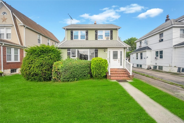 73 Bismark Ave, Valley Stream, NY 11581 - view of front of home featuring a front lawn