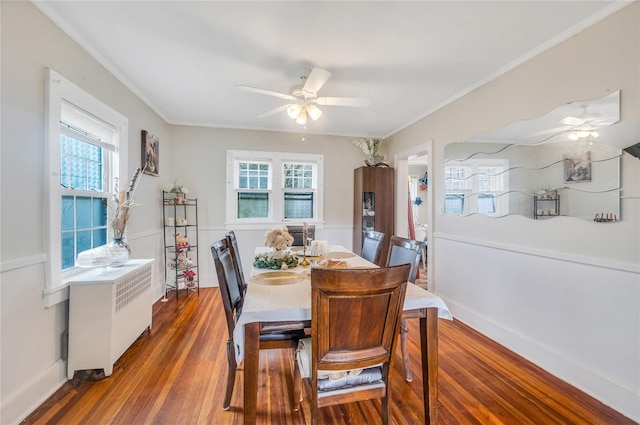 73 Bismark Ave, Valley Stream, NY 11581 - dining space with radiator, ceiling fan, wood finished floors, and crown molding