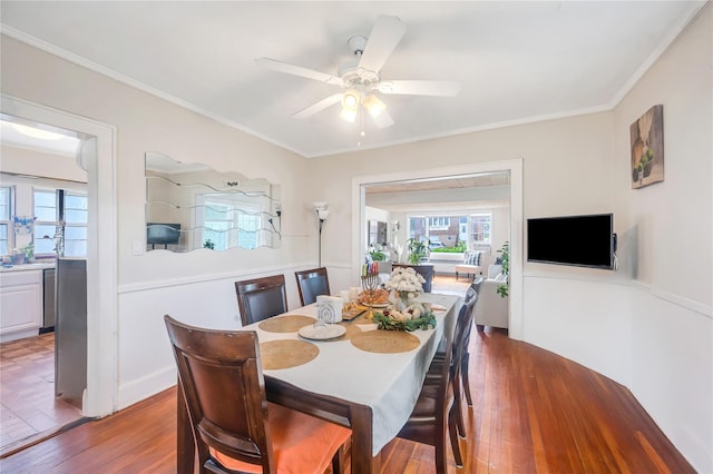 73 Bismark Ave, Valley Stream, NY 11581 - dining area featuring plenty of natural light, wood finished floors, ornamental molding, and a ceiling fan