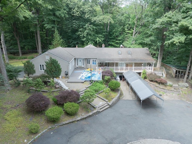 23 Sky Meadow Rd, Suffern, NY 10901 - rear view of property featuring a chimney, stairway, a deck, and a wooded view