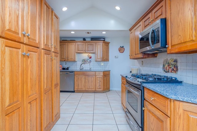 23 Sky Meadow Rd, Suffern, NY 10901 - kitchen with appliances with stainless steel finishes, light tile patterned flooring, tasteful backsplash, vaulted ceiling, and recessed lighting