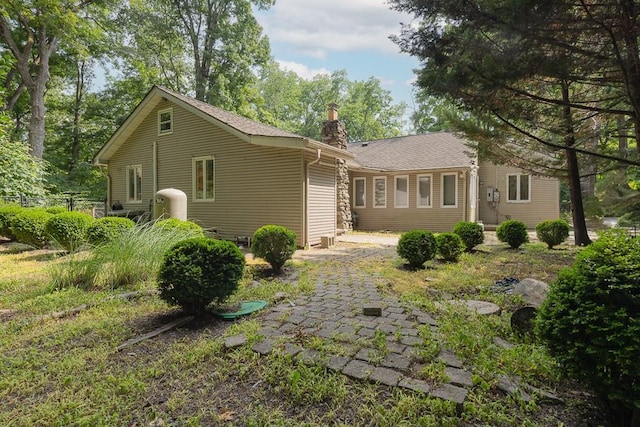 23 Sky Meadow Rd, Suffern, NY 10901 - back of house with a chimney and a shingled roof