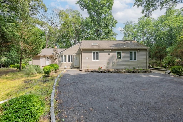 23 Sky Meadow Rd, Suffern, NY 10901 - view of front facade with driveway and a chimney