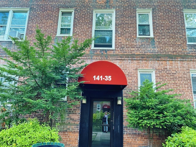 141-35 79th Ave Unit 3M, Flushing, NY 11367 - view of exterior entry featuring brick siding