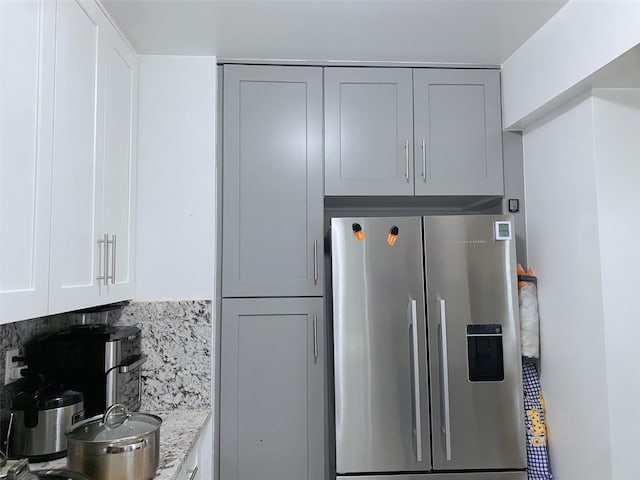 141-35 79th Ave Unit 3M, Flushing, NY 11367 - kitchen featuring stainless steel fridge and white cabinetry