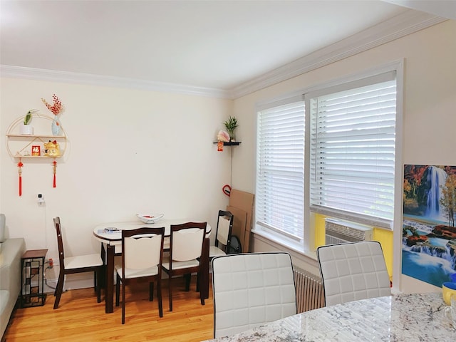 141-35 79th Ave Unit 3M, Flushing, NY 11367 - dining area with ornamental molding, light wood-style floors, and cooling unit
