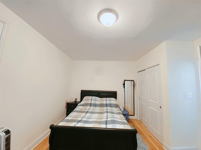 141-35 79th Ave Unit 3M, Flushing, NY 11367 - bedroom with light wood-style floors and a closet