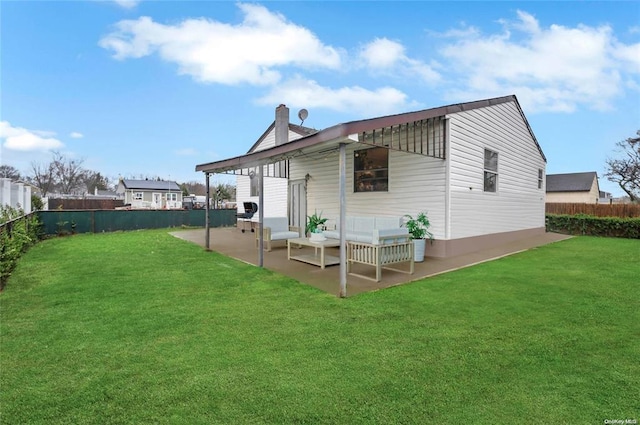 246 15th St, West Babylon, NY 11704 - back of property featuring a patio, a fenced backyard, a chimney, and outdoor lounge area