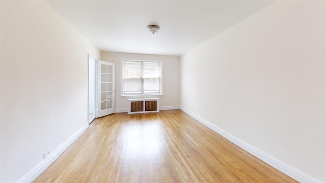 151 Prospect Unit 3-F, Mount Vernon, NY 10550 - spare room with light wood-style flooring and radiator