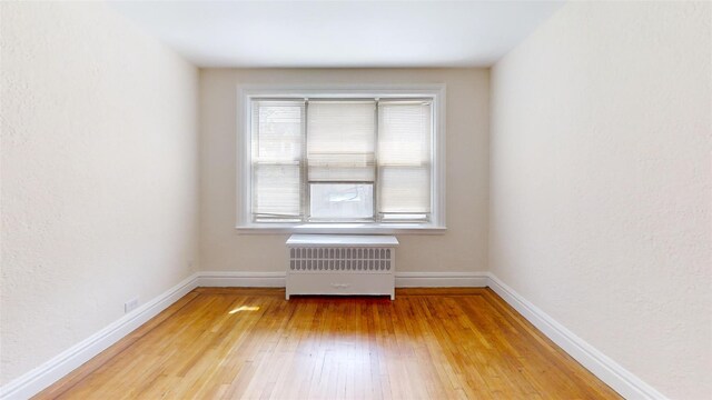 151 Prospect Unit 3-F, Mount Vernon, NY 10550 - empty room with radiator and light wood-style floors