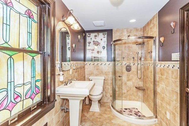25 Reyam Rd, Lynbrook, NY 11563 - full bathroom with tile walls, a shower stall, and tile patterned flooring