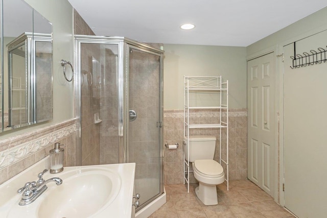 25 Reyam Rd, Lynbrook, NY 11563 - bathroom featuring tile walls, a stall shower, tile patterned floors, wainscoting, and recessed lighting