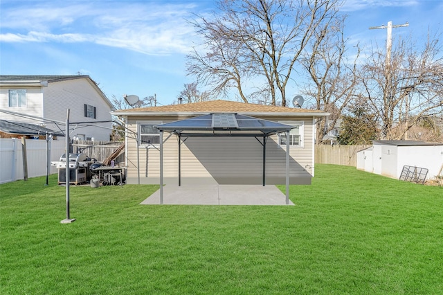 1002 Park Ave, Westbury, NY 11590 - rear view of property featuring a gazebo, a patio, and a fenced backyard
