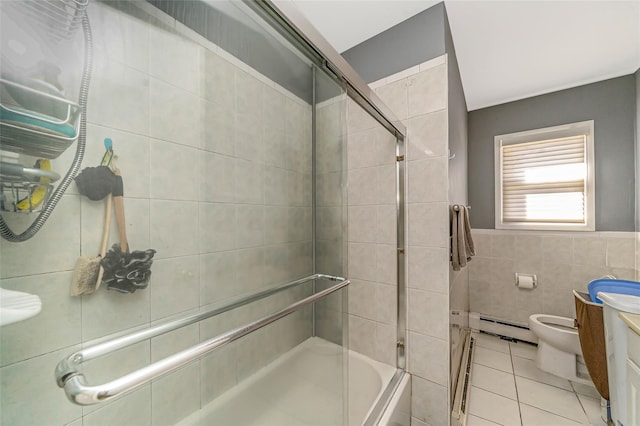 1002 Park Ave, Westbury, NY 11590 - full bath featuring tile walls, a baseboard radiator, vanity, and tile patterned flooring