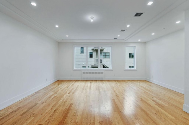 5 Francis Pl Unit 214, Monsey, NY 10952 - spare room featuring radiator heating unit, light wood-style floors, ornamental molding, and recessed lighting
