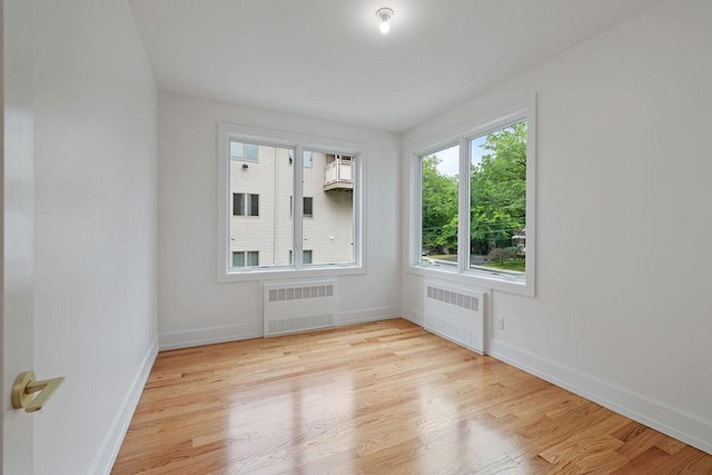 5 Francis Pl Unit 214, Monsey, NY 10952 - unfurnished room featuring radiator heating unit and light wood-style floors