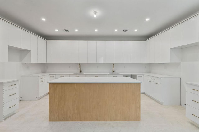 5 Francis Pl Unit 214, Monsey, NY 10952 - kitchen with a kitchen island, modern cabinets, white cabinets, and recessed lighting