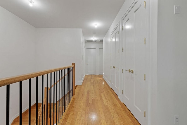 5 Francis Pl Unit 214, Monsey, NY 10952 - hall with light wood-style floors and an upstairs landing