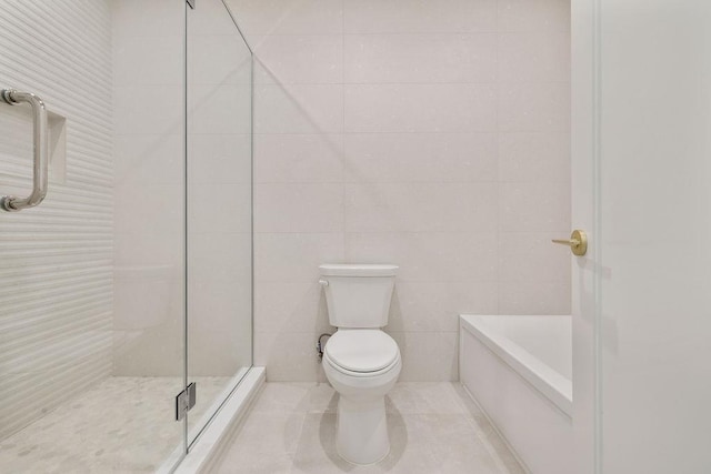 5 Francis Pl Unit 214, Monsey, NY 10952 - bathroom featuring tile walls, a shower, and a tub to relax in