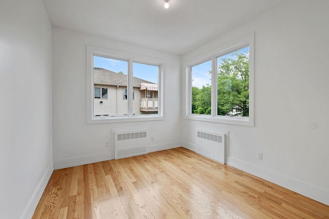 5 Francis Pl Unit 214, Monsey, NY 10952 - empty room featuring radiator heating unit and light wood-type flooring