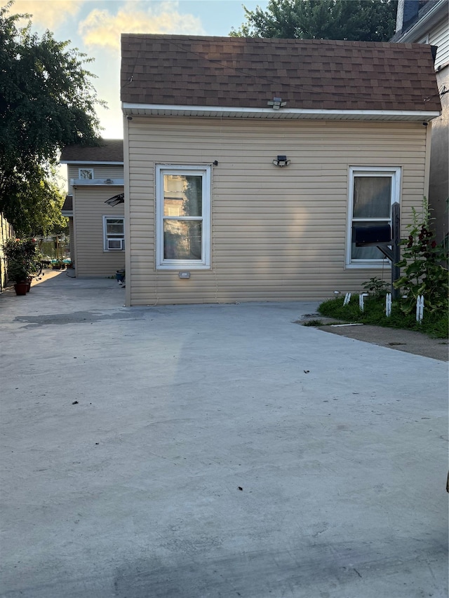 616 Port Richmond Ave, Staten Island, NY 10302 - back of house at dusk featuring a shingled roof