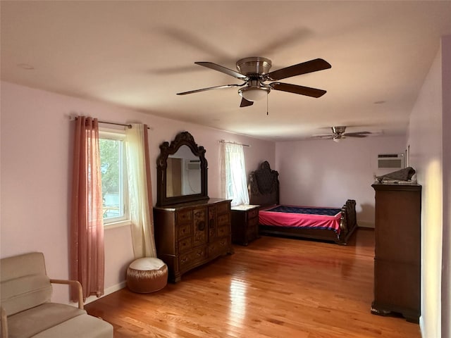 616 Port Richmond Ave, Staten Island, NY 10302 - bedroom featuring light wood-style floors, ceiling fan, and a wall unit AC