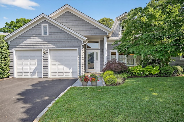 48 Fieldstone Ln, Oyster Bay, NY 11771 - view of front of house featuring driveway, a front yard, and an attached garage