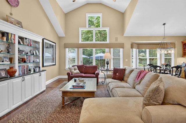 48 Fieldstone Ln, Oyster Bay, NY 11771 - living area featuring a chandelier, dark wood-type flooring, and high vaulted ceiling