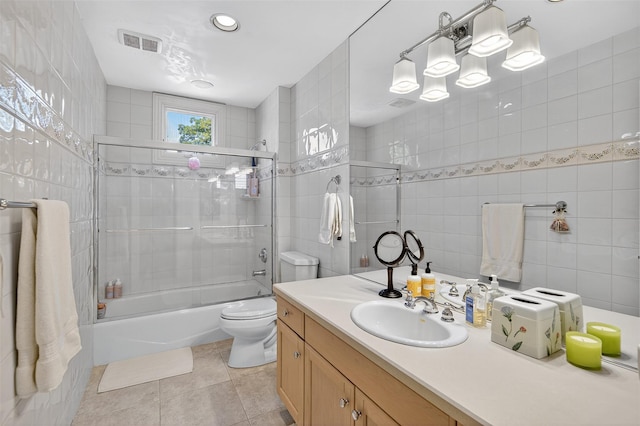 48 Fieldstone Ln, Oyster Bay, NY 11771 - bathroom featuring vanity, enclosed tub / shower combo, tile patterned flooring, and tile walls
