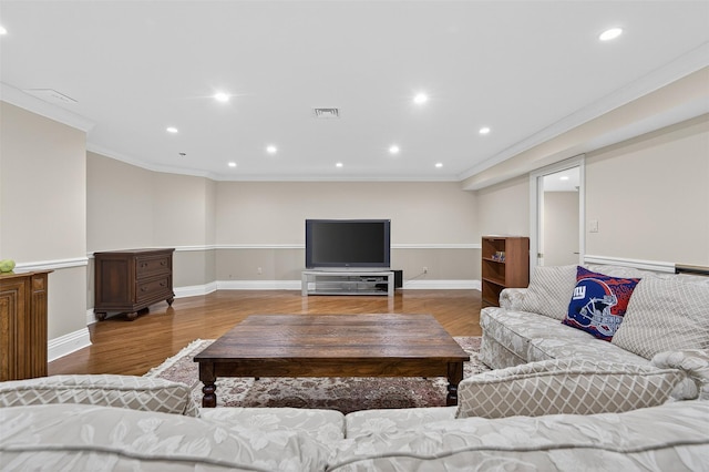 48 Fieldstone Ln, Oyster Bay, NY 11771 - living room featuring wood finished floors, ornamental molding, and recessed lighting