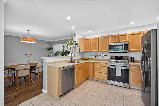 36 Bush Creek Ln, Poughquag, NY 12570 - kitchen featuring appliances with stainless steel finishes, light countertops, recessed lighting, a peninsula, and ornamental molding